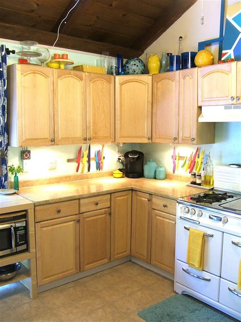 Professional spray painting kitchen cabinets. First we removed the cabinets & hardware: