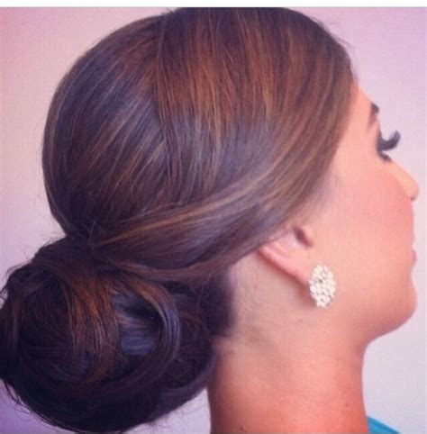 The bride's hairdo for the reception look is all set. Elegant bun | Up hairstyles, Elegant bun, Wedding hairstyles