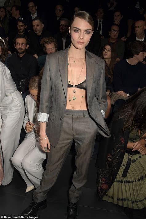 cara delevingne showcases her toned abs in a semi sheer bra at dior homme fashion show in paris
