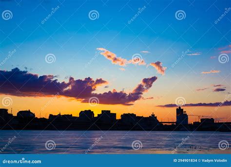Nature S Farewell: Sunset Over City and Water Stock Photo - Image of