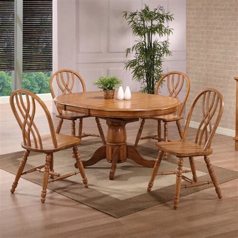 Almost any style of chairs will go with this type of table, but to keep the organic look going, opt for simple brown leather chairs and add a splash of color with. ECI Rustic Oak Round Single Pedestal Table & Reviews | Wayfair
