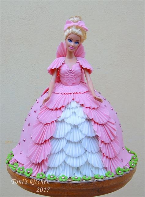 The skirt is covered in plastic to protect during use as a cake decoration. Princess doll cake - cake by Cakes by Toni - CakesDecor