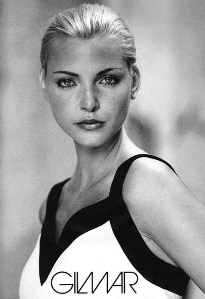 A Black And White Photo Of A Woman Wearing A Tank Top With The Word