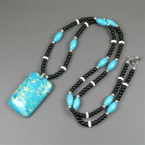 Turquoise Magnesite Pendant On Beaded Strand Of Turquoise Blue