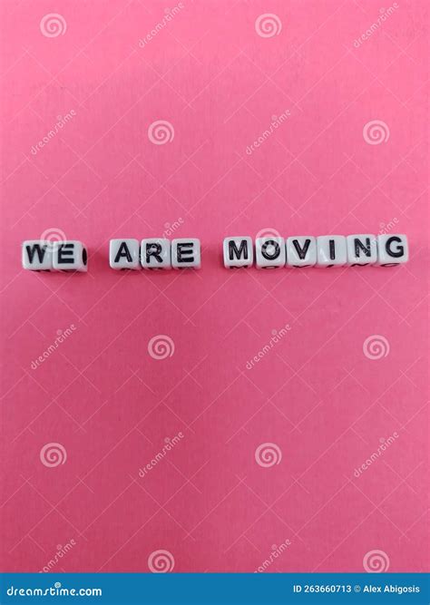 We Are Moving Sign On A Pink Background Stock Image Image Of Font