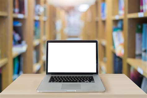 Computer Laptop In Library Cation And Technology Concept