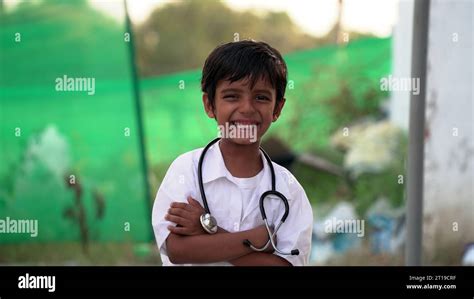 Cute Small Indian Kid Boy Wear Medical Uniform Holding Stethoscope