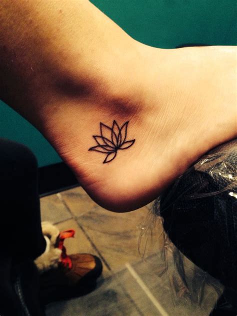Black Foot Lotus Flower Tattoo