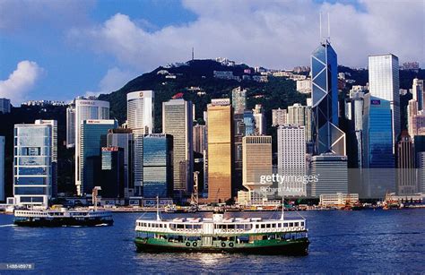 Star Ferry On Victoria Harbour With Hong Kong Skyline In Background