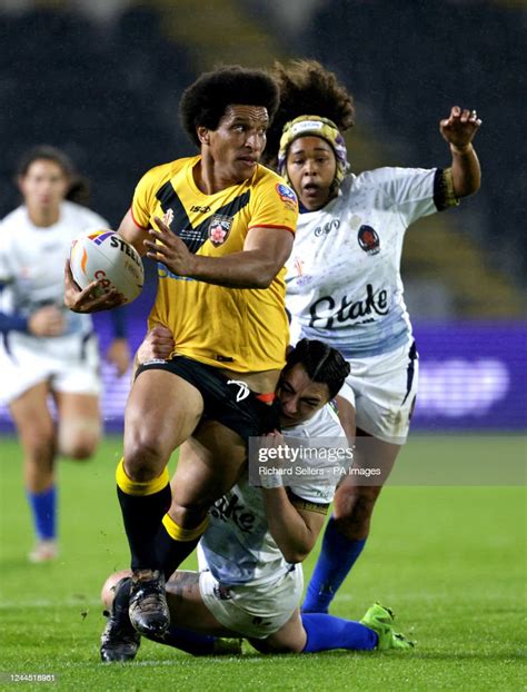 Papua New Guineas Elsie Albert Is Tackled During The Womens Rugby