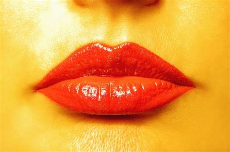 premium photo close up view of beautiful woman lips with golden skin
