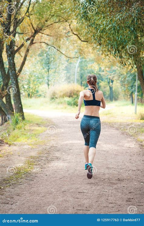 Active Beautiful Woman Running In The Park Healthy Lifestyle Stock