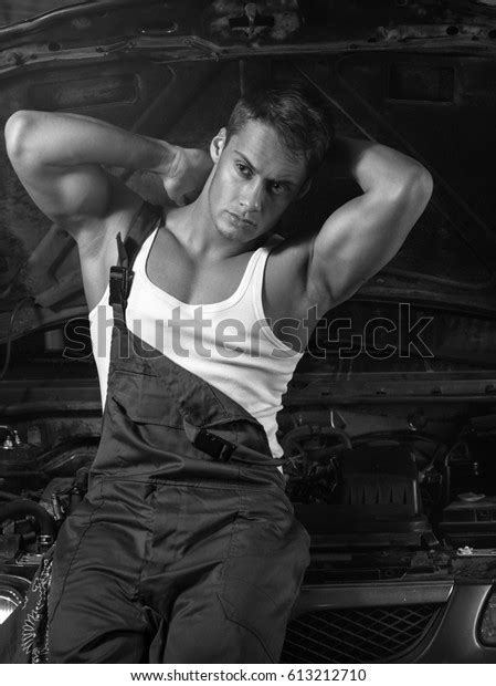 Sexy Male Mechanic Sits On Hood Foto Stock Shutterstock