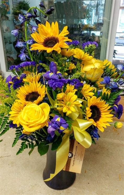 .iris wedding bouquet to complement a beach wedding, a blue themed wedding, a winter wedding or a summer casual romantic and sleek wedding. Iris and sunflower bouquet with a twist of springtime by ...