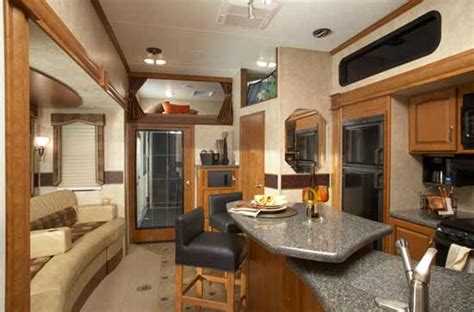 .toy hauler fifth wheel toy hauler travel trailer class a motorhome class c motorhome toy hauler motorhome used rvs bath and a half bunkhouse front bath front bedroom front kitchen front living kitchen island murphy bed outdoor kitchen patio rear bath rear bedroom rear. 2010 Keystone Raptor Fifth Wheel Toy Hauler | Roaming Times
