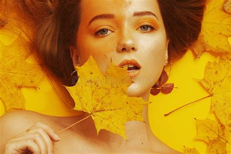 Beautiful Brunette With Fashion Make Up Lies In Autumn Leaves Fashion