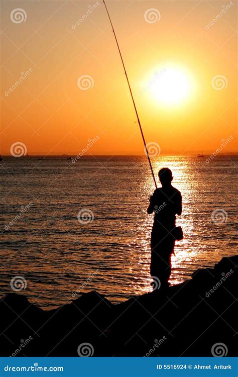 Fisherman Silhouette On Sunset Stock Images Image 5516924