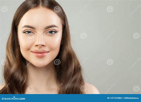Pretty Woman Face Beautiful Female Model Face With Clear Skin And Healthy Brown Hair Close Up