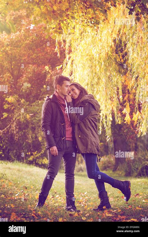 Couple Embracing On Colorful Autumn Forest Stock Photo Alamy