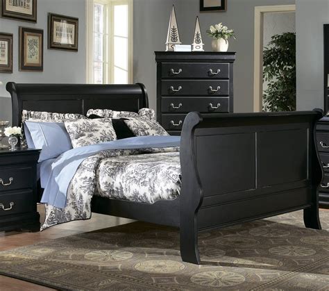 The ruffled bedding is paired with a gray striped bedspread. Black sleigh bed w/toile | Bedroom furniture online ...
