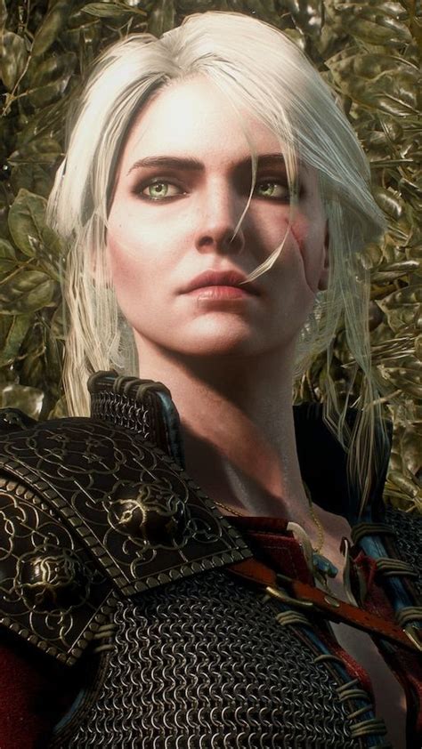 A Woman With White Hair And Green Eyes Wearing Armor In Front Of Some Bushes Looking At The Camera