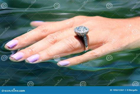 Beautiful Engagement Ring In Hand Over Water Stock Image Image Of