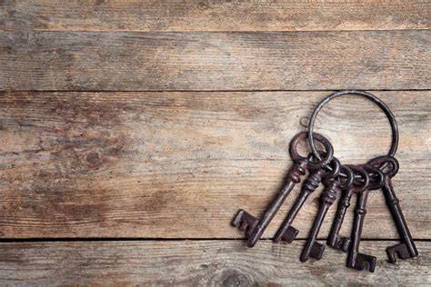 Bunch Of Old Vintage Keys On Wooden Background Top View Stock Photo