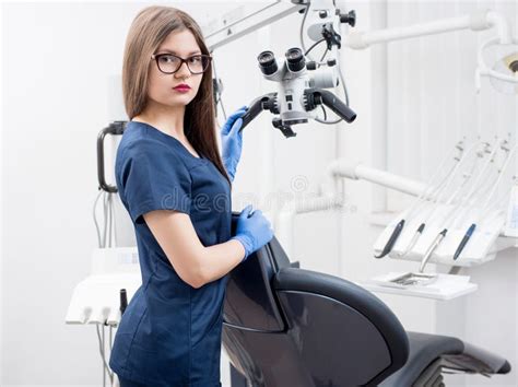 Portrait Of Beautiful Female Dentist At The Modern Dental Office Stock