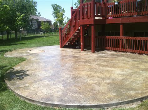 Learn how concrete stain color and a wet look clear concrete sealer gave our stamped concrete patio a diy makeover in one weekend. Concrete Services | Stamped Concrete | Concrete Repair