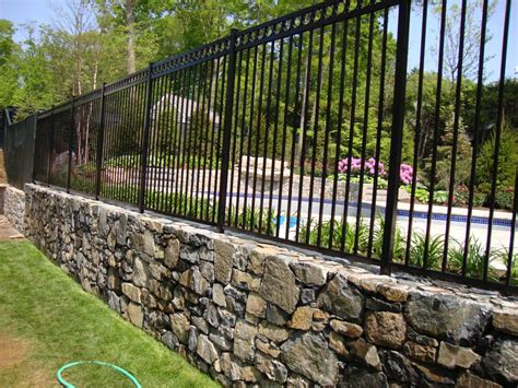 Just your standard suburban privacy fence. 6' high Windsor plus core drilled into stone wall ...
