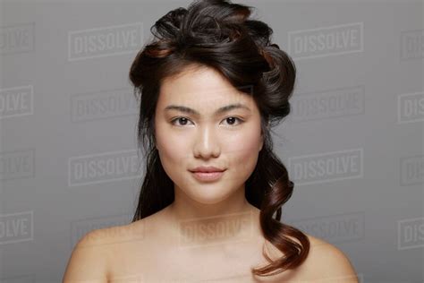 Head And Shoulders Shot Of Young Woman Bare Shouldered Stock Photo