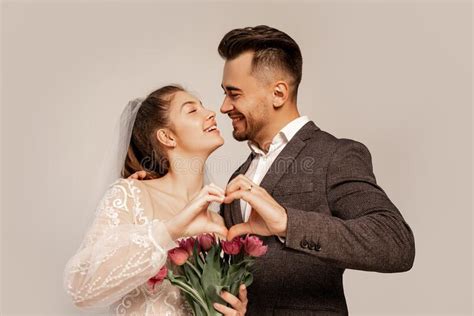 Joyful Newlyweds Smiling At Each Other Stock Photo Image Of Greyish