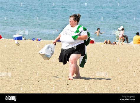 Obese Woman Walking On The Beach In Wisconsin Stock Photo Alamy