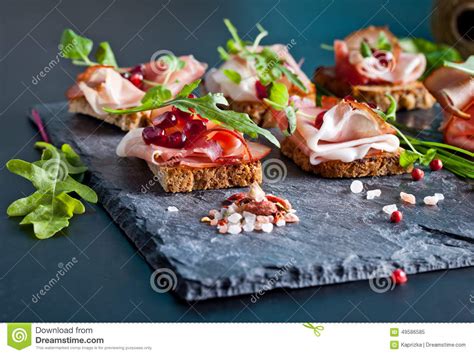 Sliced Prosciutto With Herbs And Pomegranate Seeds Stock Image Image