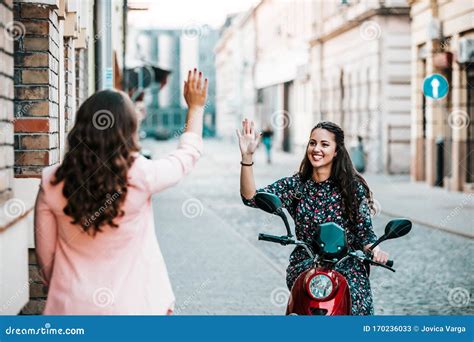 Two Happy Friends Meeting And Greeting In The Street Stock Image