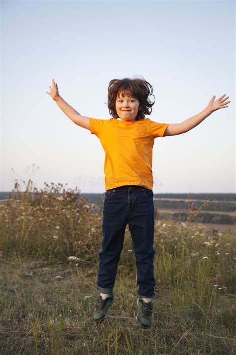Boy Playing Jumping On Summer Sunset Meadow Stock Image Image Of