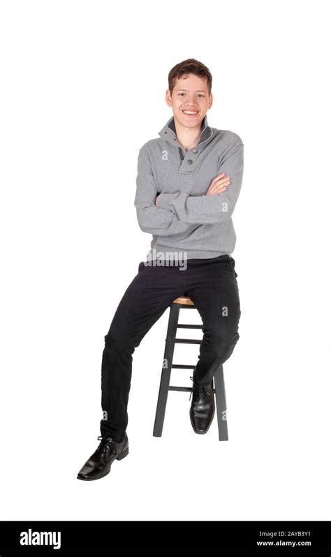 A Handsome Lovely Teenage Boy Sitting And Smiling Stock Photo Alamy