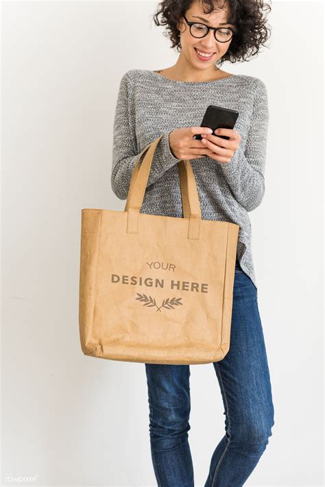 Woman Holding Design Space Leather Tote Bag Premium Image By Rawpixel