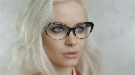Portrait Of Beautiful Blonde Woman With Glasses By