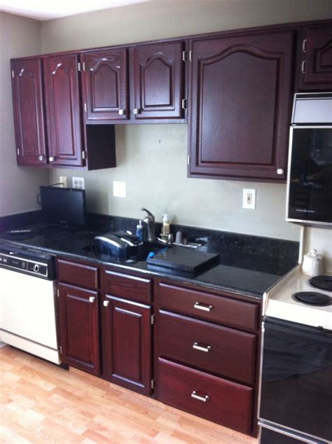 Burgundy cabinets are becoming less popular with time, causing them to be a bit dated. Kitchen cabinets that were golden oak, we changed it to ...