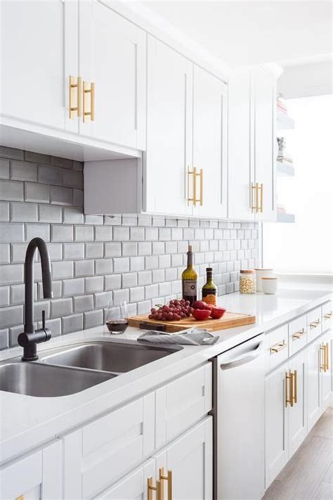 For a timeless look, try white shaker cabinets and black hardware. White shaker cabinets in a contemporary kitchen fitted with brass pulls accented with gray ...