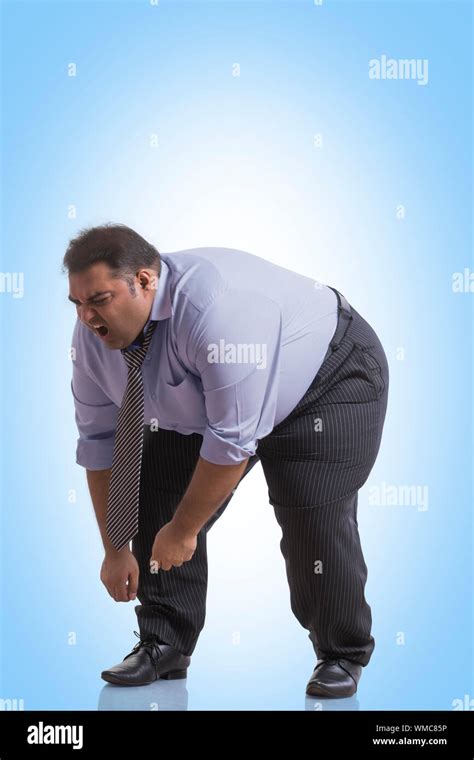 Obese Man In Formal Clothes Bending Forward In Pain Stock Photo Alamy