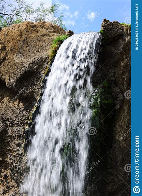Jungle Waterfall Cascade In Tropical Rainforest With Rock And Turquoise