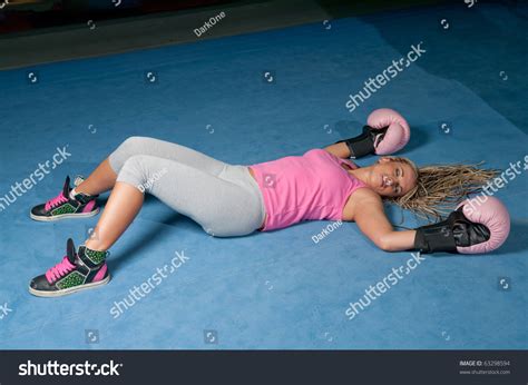Стоковая фотография 63298594 Pretty Female Boxer Knocked Out Laying
