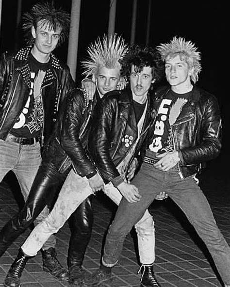 Five Punk Rockers Posing In Black Leather Jackets