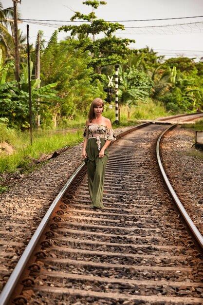 Premium Photo Middle Aged Woman Standing On Sri Lankan Railway Track