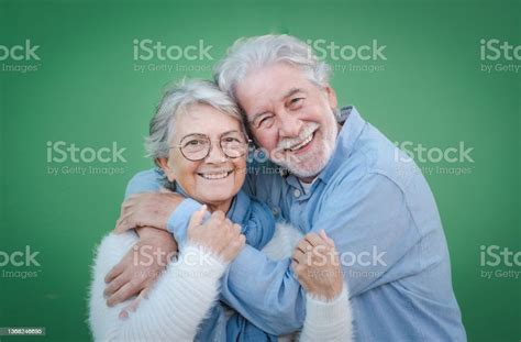 Happy Elderly Adult Mature Couple In Love Senior Husband And Wife Hugging And Bonding With True