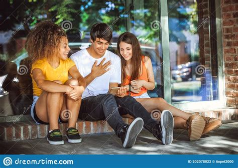 Group Of Teenagers On The Street With Cellphones Stock Photo Image Of