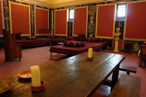 A room where feasting elites threw up to make room for more food. archaeological recreation of a Roman villa triclinium ...