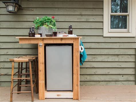 Not only is the mini fridge cabinet totally gorgeous, but oh so functional too! Summer Backyard DIY Design Ideas | HGTV